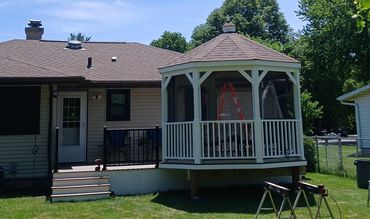 Composite decking with a screened-in gazebo by Thomm & Murf Remodeling, deck builders in Madison, WI