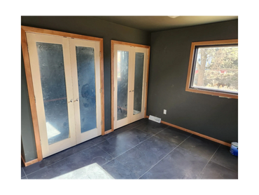 Basement remodel by Thomm & Murf Remodeling with custom doors and tile flooring