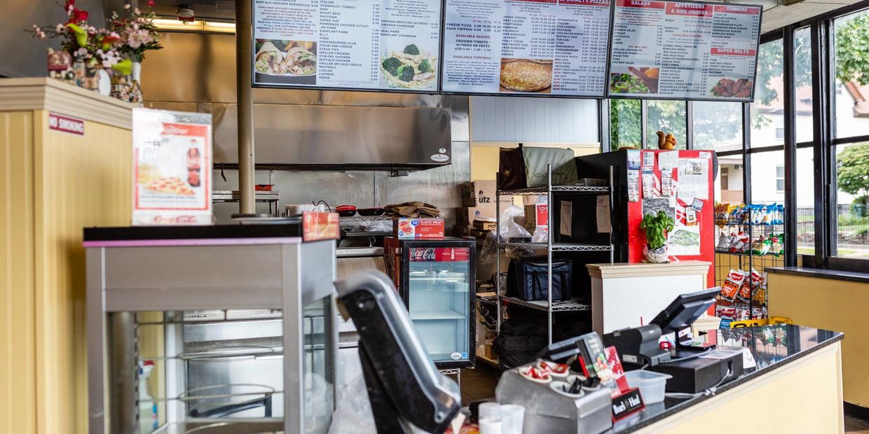 Order desk of a pizza store with computers