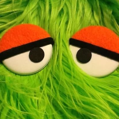 Puppet eyes in green fur