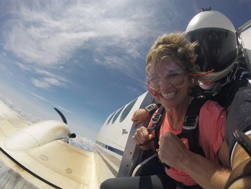 Will takes a happy customer for a skydive out of the King Air.