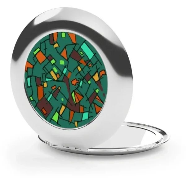 Silver compact mirror with abstract colorful design.