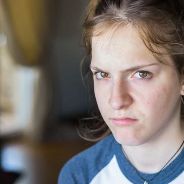 Young woman with an angry expression.