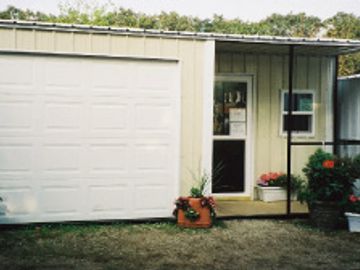 Office Shed or Cabin Shed.  Designed with roll up Door and Walk Door.  Optional porch available.