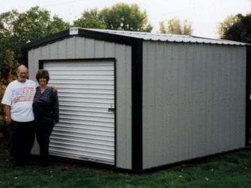 Security Shed.  Steel utility shed with roll up door.  