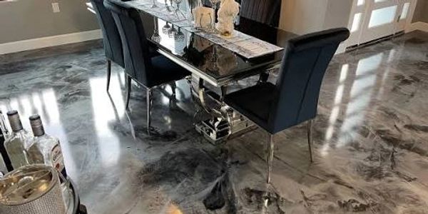 Modern dining area with a reflective marble floor.