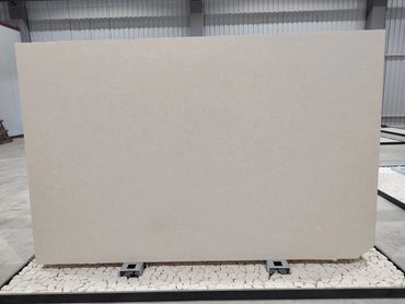 Limra Cloudy Limestone slab with soft cloudy patterns and refined natural texture.