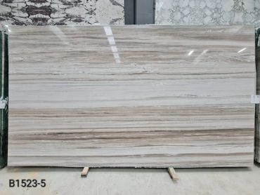 Bookmatched Palissandro Marble with soft beige tones and natural linear texture.