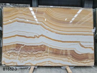 High quality Turkish Mango Onyx slab with polished surface and natural translucency.