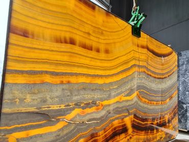 Luxury Turkish Mango Onyx slab with warm honey tones for premium interior projects.
