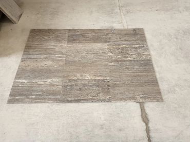 Titanium Silver Travertine Vein Cut slab with rich grey bands for luxury architecture.
