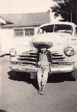 <img src=johnwith1948chevyfleetmaster.jpg alt=John with mothers 1948 Chevy Fleetmaster Encinal>