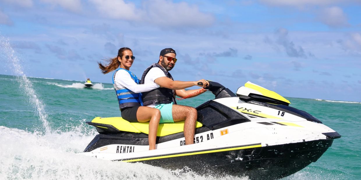 couple riding a jet ski from archie jet ski rentals in Puerto Rico