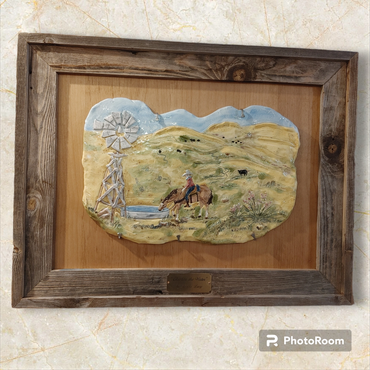 This is a unique clay sculpted and wood wall hanging. It has a barn wood frame. It is approximatel