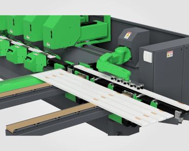 Automated green robotic arm sorting long white panels on a conveyor system.