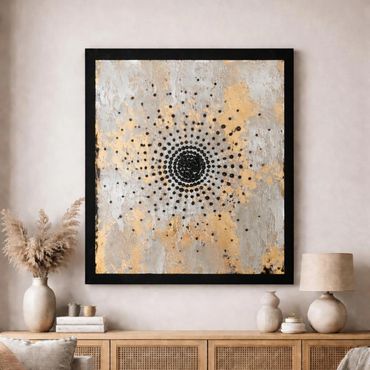 Abstract artwork with black dots radiating from center on textured gold and silver background.