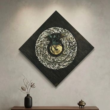 Square black wall art with circular white and gold design.
