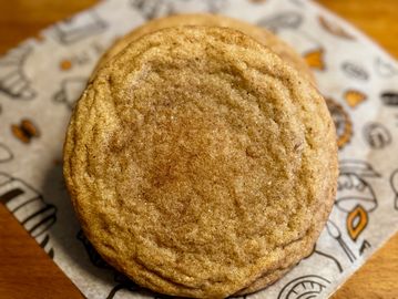 Snickerdoodle cookies displayed on parchment.