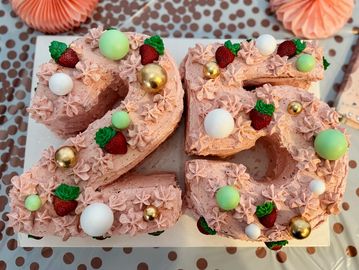 Strawberry 25 number cake with decorative accents.