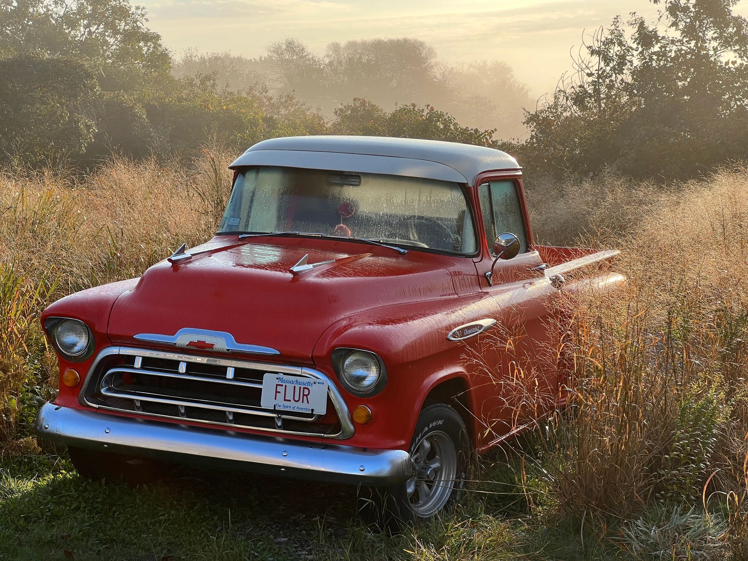 Red vintage farm truck sunrise.