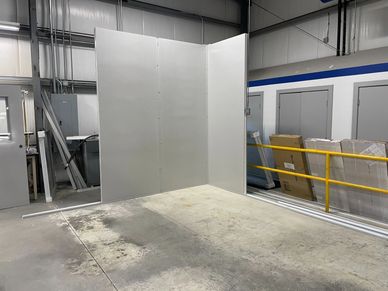 Fully custom modular buildings being constructed inside a warehouse setting by SoFlo installations