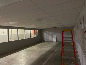 Inside an empty fully constructed modular building with windows