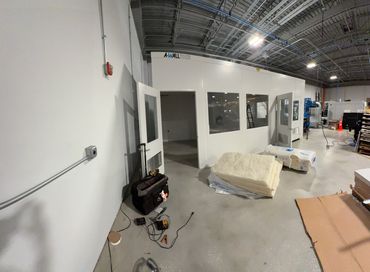 A partially Modular Installation & Designs of prefab buildings with several windows and a door