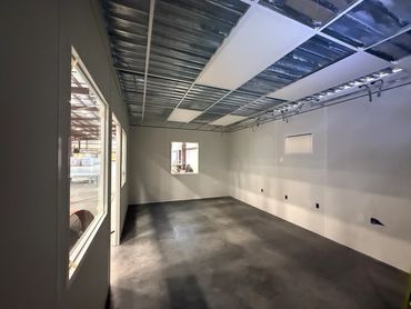 inside a prefab building with the drop ceiling partially done by SoFlo solutions a Modular Installat