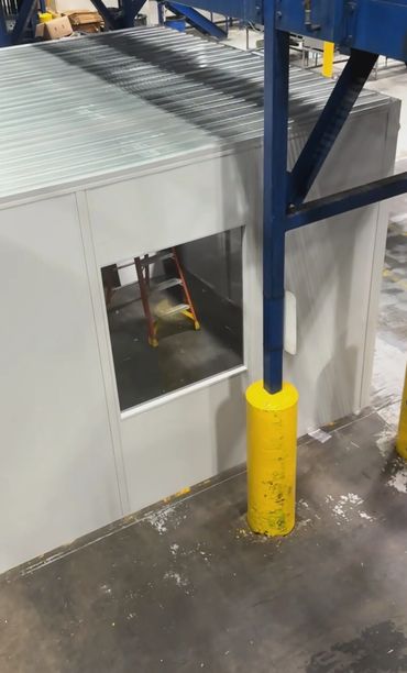 An aerial view of a new prefab building with a window, installed by SoFlo installations inside a war