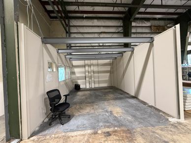 Building a load bearing office inside a warehouse for optimal storage on top.