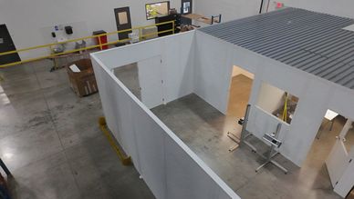 A modular wall partition has been installed in the warehouse to separate the food area from the rest