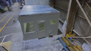 An aerial view of an implant prefab building installation inside and industrial setting