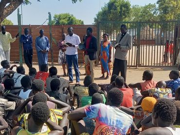 Sharing the gospel with the prisoners.