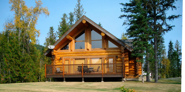Custom log cabin home design with timber beams, covered deck, and mountain setting in Northwest Montana. We work with builders and contractors throughout the Flathead Valley, Whitefish, Kalispell, Eureka, and surrounding Northwest Montana communities.