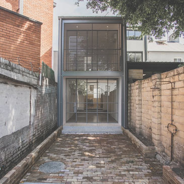 An architectural renovation of an old 1800's inner city terrace. Shows steel windows