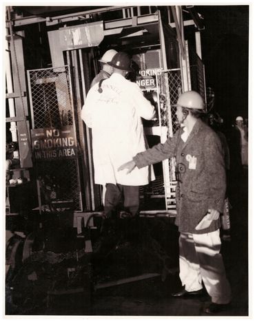 Gene putting Ham in pad elevator.  Ham would never forgive him.