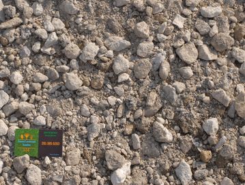 Crushed Concrete with Coastal Landscape Supplies business card in the corner.
