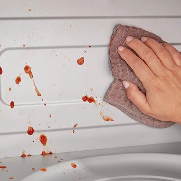 Wiping a microwave spill
