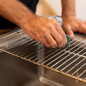 Clean oven racks regularly