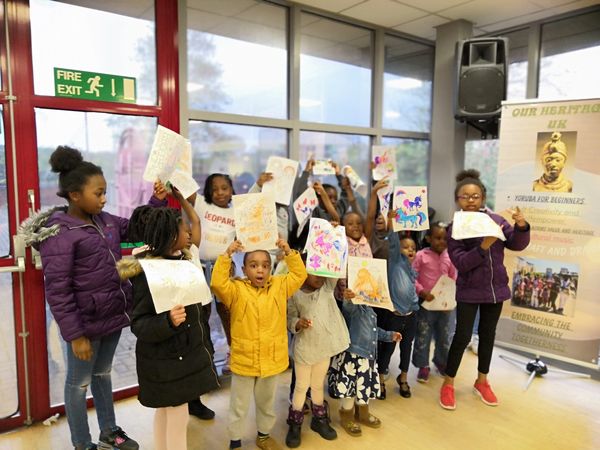 Group of kids holding their artworks