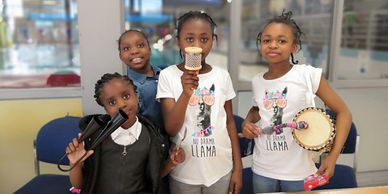 Young kids rehashing cultural songs and drumming activities