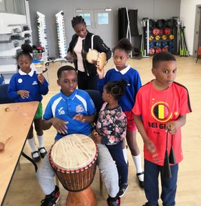 Children learning cultural drumming