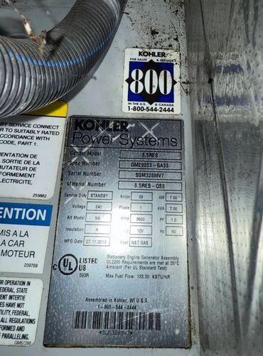 Kohler Power Systems generator label with specifications and contact info.