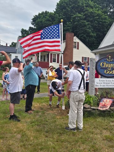Raising a new flagpole and flag in front of a Church in Rochester NH