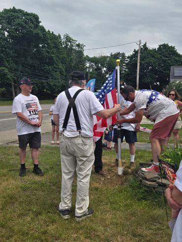 Raising a new flagpole and flag in front of a Church in Rochester NH