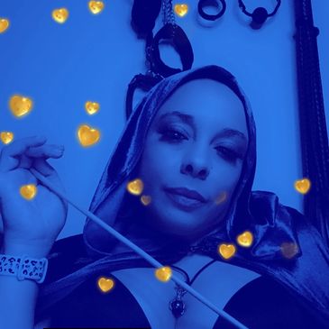 Woman in blue filter with heart effects, wearing a hood and holding a stick.