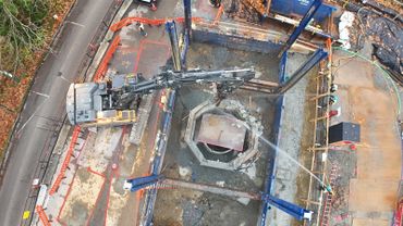 Aerial view of a construction site with heavy machinery and workers.