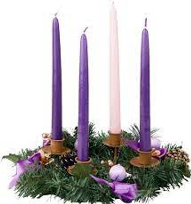 Advent wreath with three purple candles and one pink candle on greenery base.
