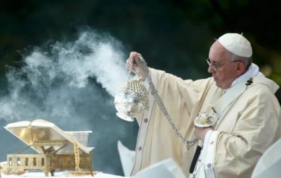 Pope performing a religious ritual with incense during a ceremony.