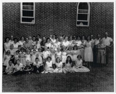 Children and women of the church standing outside in the early 1950's.